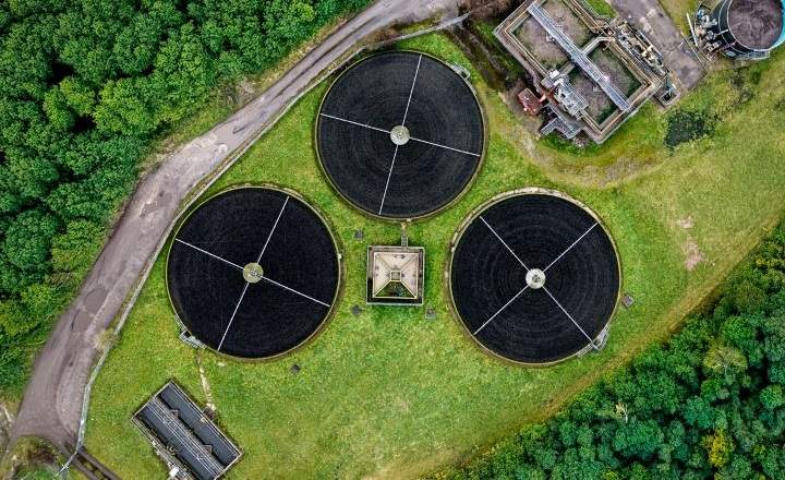 Wastewater silos next to facility.
