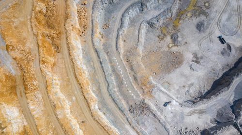 Open mining pit showing environmental contamination.